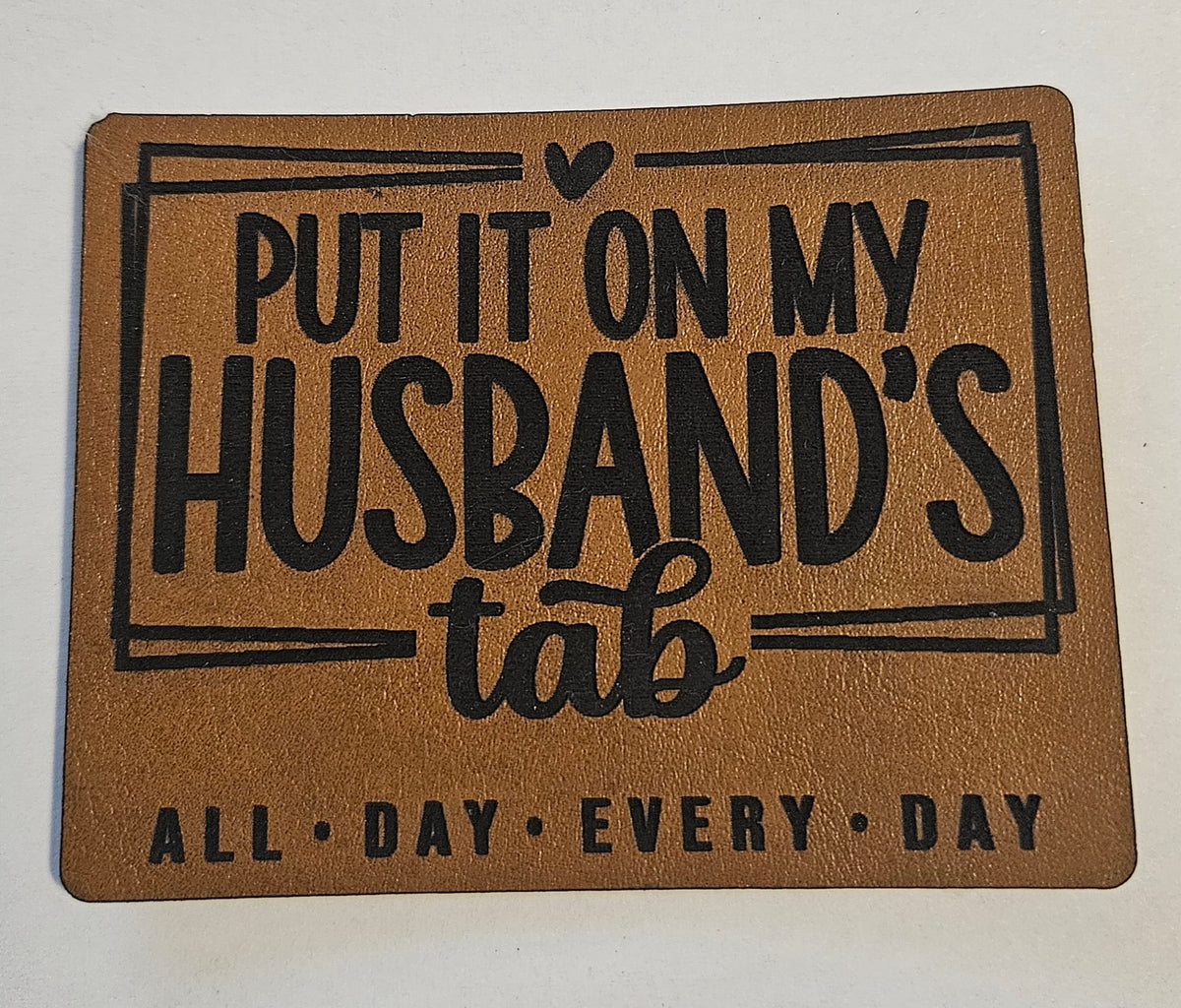 Put it on my husband's Tab Faux Leather iron on hat patch