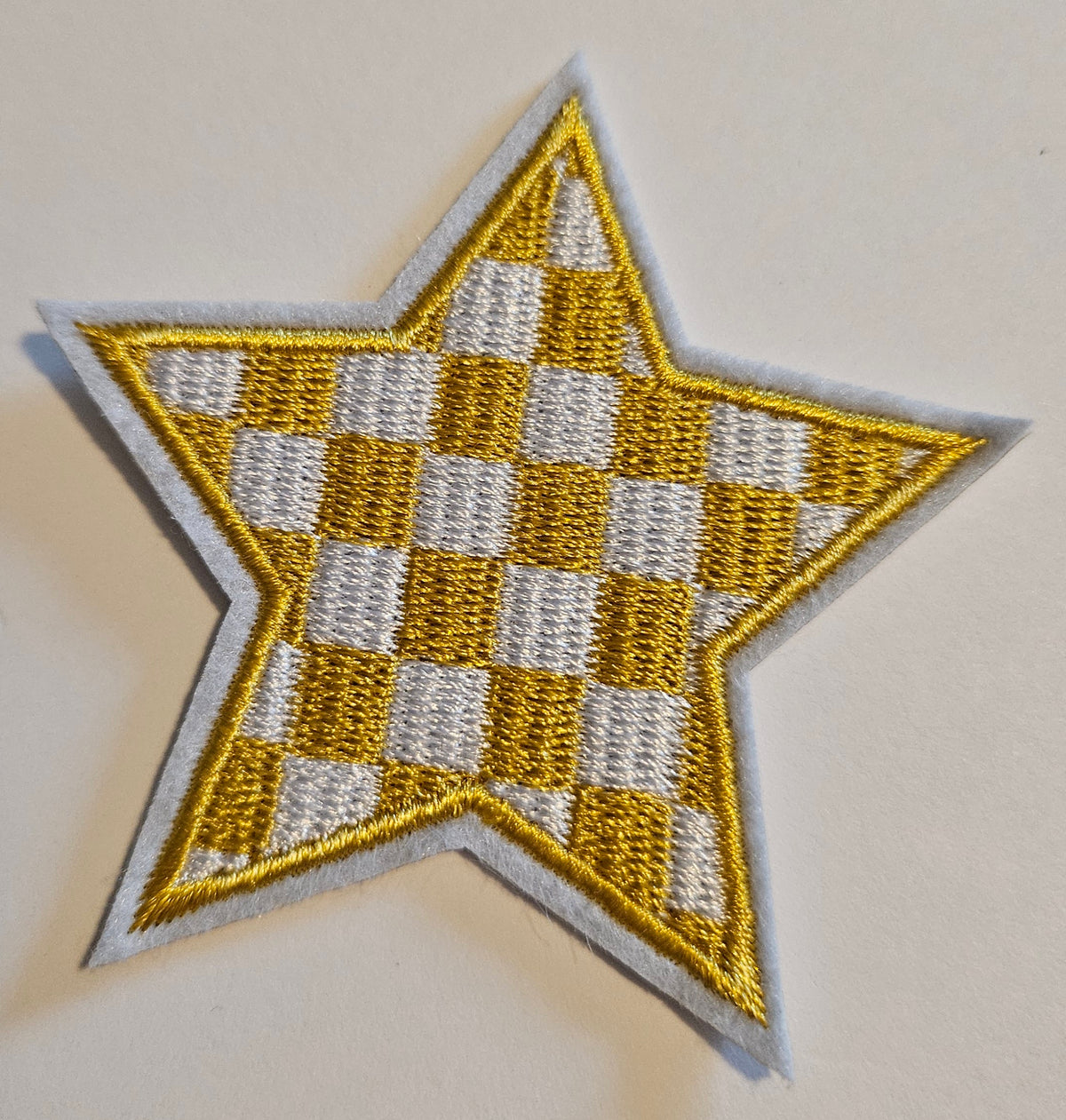 Yellow check star hat patch